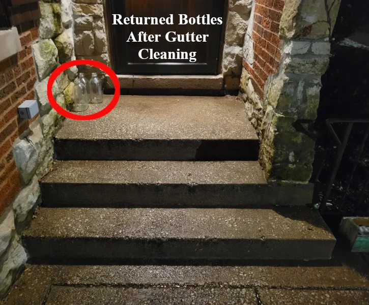 a clean, still wet front porch that was pressure washed after gutter cleaning services performed